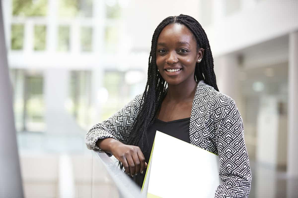 A young professional at a desk in a UK office - the Graduate visa lets holders work in almost any role without an employer sponsor licence.