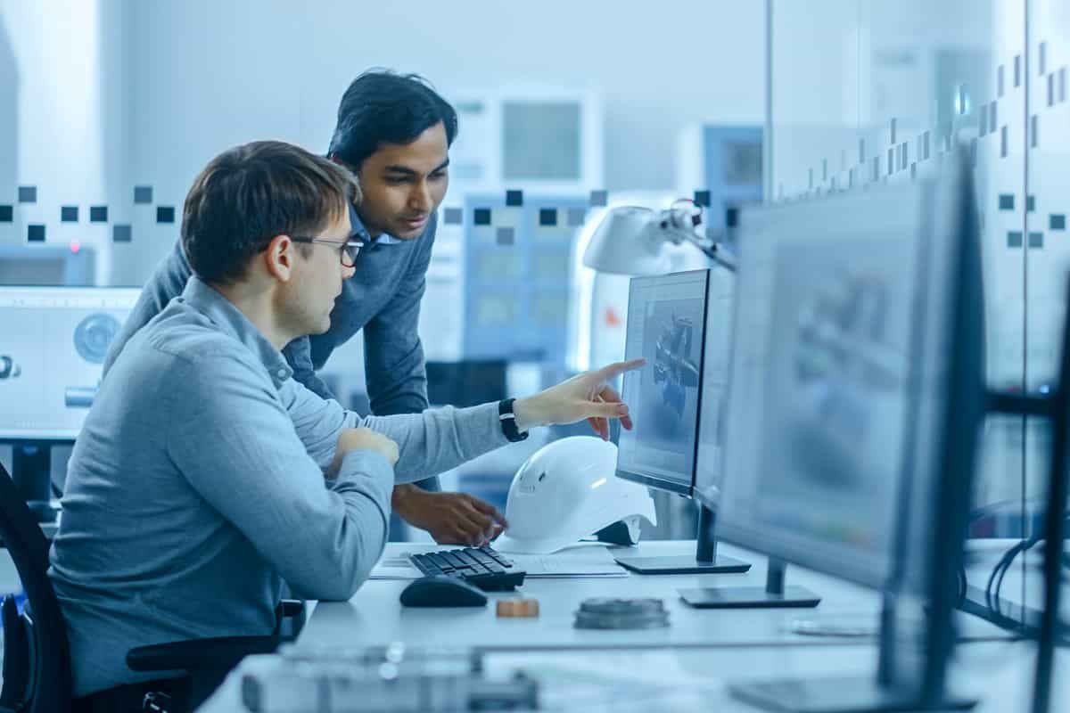 A doctor consulting with a colleague on a hospital ward - many Skilled Worker roles in health and engineering sit inside their occupation's going-rate band.