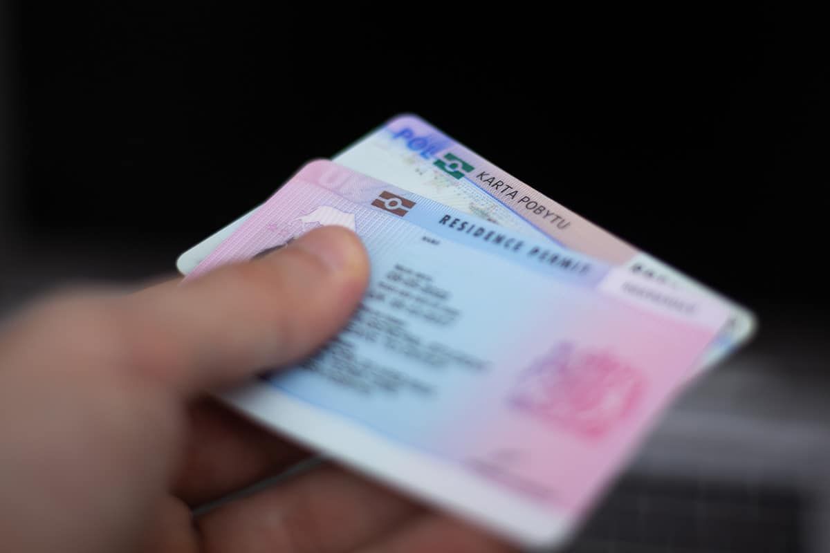 An engineer on-site in the UK reviewing plans - Skilled Worker applications start with a sponsor's Certificate of Sponsorship for a role on the eligible list.