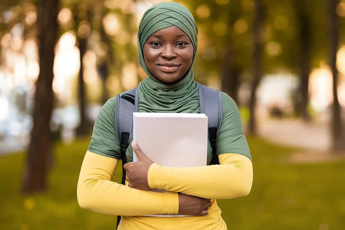 A recent graduate at a UK laptop looking at Graduate visa and Skilled Worker information - the Student route often ends with a switch, not a departure, and the timing matters.