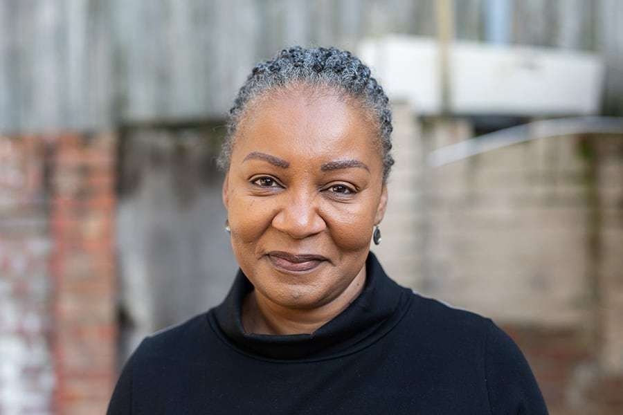 A completed Windrush Compensation Scheme claim form on a solicitor's desk - the compensation scheme is separate from the status scheme and often needs to be run alongside it.